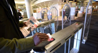 Fastlane Glassgate 150 optical turnstile from Smarter Security integrated with mobile credential reader